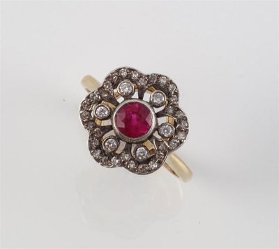 Appraisal: A ruby and diamond cluster ring The circular cut ruby