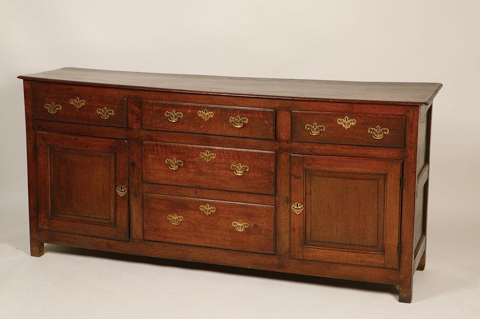 Appraisal: A GEORGE III OAK DRESSER the rectangular top with a