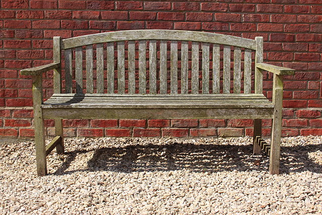 Appraisal: AN OLD TEAK GARDEN BENCH with slatted back and seat