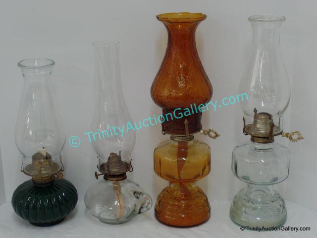 Appraisal: Vintage Style Oil Lamps Includes Lamplight model made in the