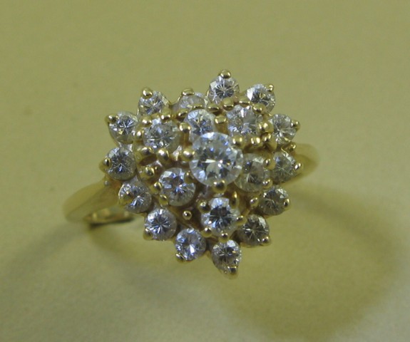 Appraisal: DIAMONDS AND FOURTEEN KARAT GOLD RING with round-cut diamonds forming