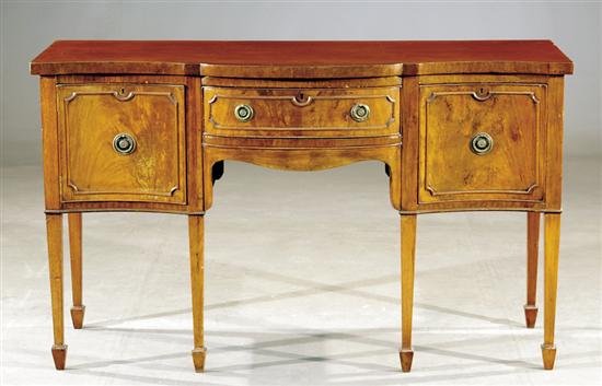 Appraisal: George III style serpentine mahogany sideboard th centuryshaped top over