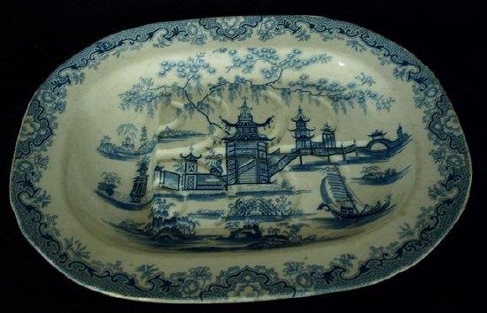 Appraisal: A th Century transfer printed meat dish with gravy tree