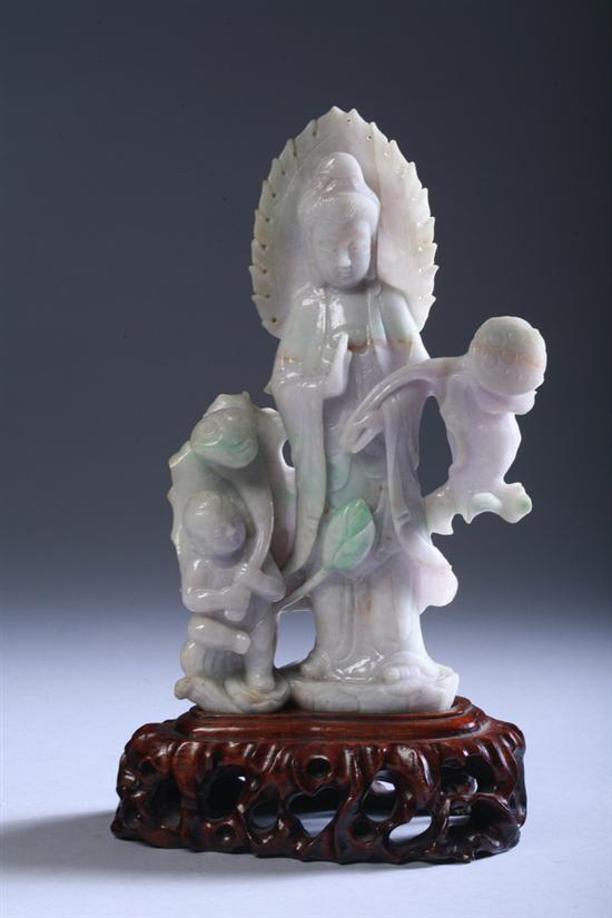 Appraisal: CHINESE WHITE LAVENDER AND APPLE GREEN FIGURE OF GUANYIN AND