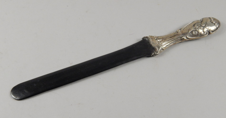 Appraisal: An Edwardian silver mounted and ebonised page turner the handle