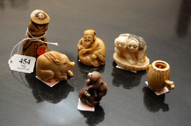 Appraisal: A COLLECTION OF JAPANESE IVORY AND BONE NETSUKE Comprising five