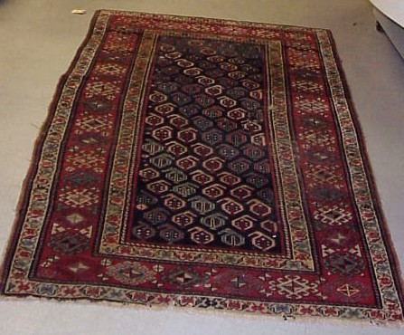 Appraisal: Antique Caucasian scatter rug x blue field with repeated botehs