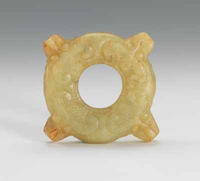 Appraisal: Chinese Carved Jade Ornament with Dragon Masks Thick disk with