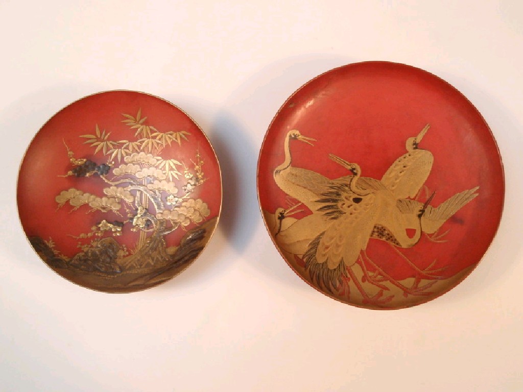 Appraisal: A Japanese red lacquered shallow circular dish hand-painted in gilt