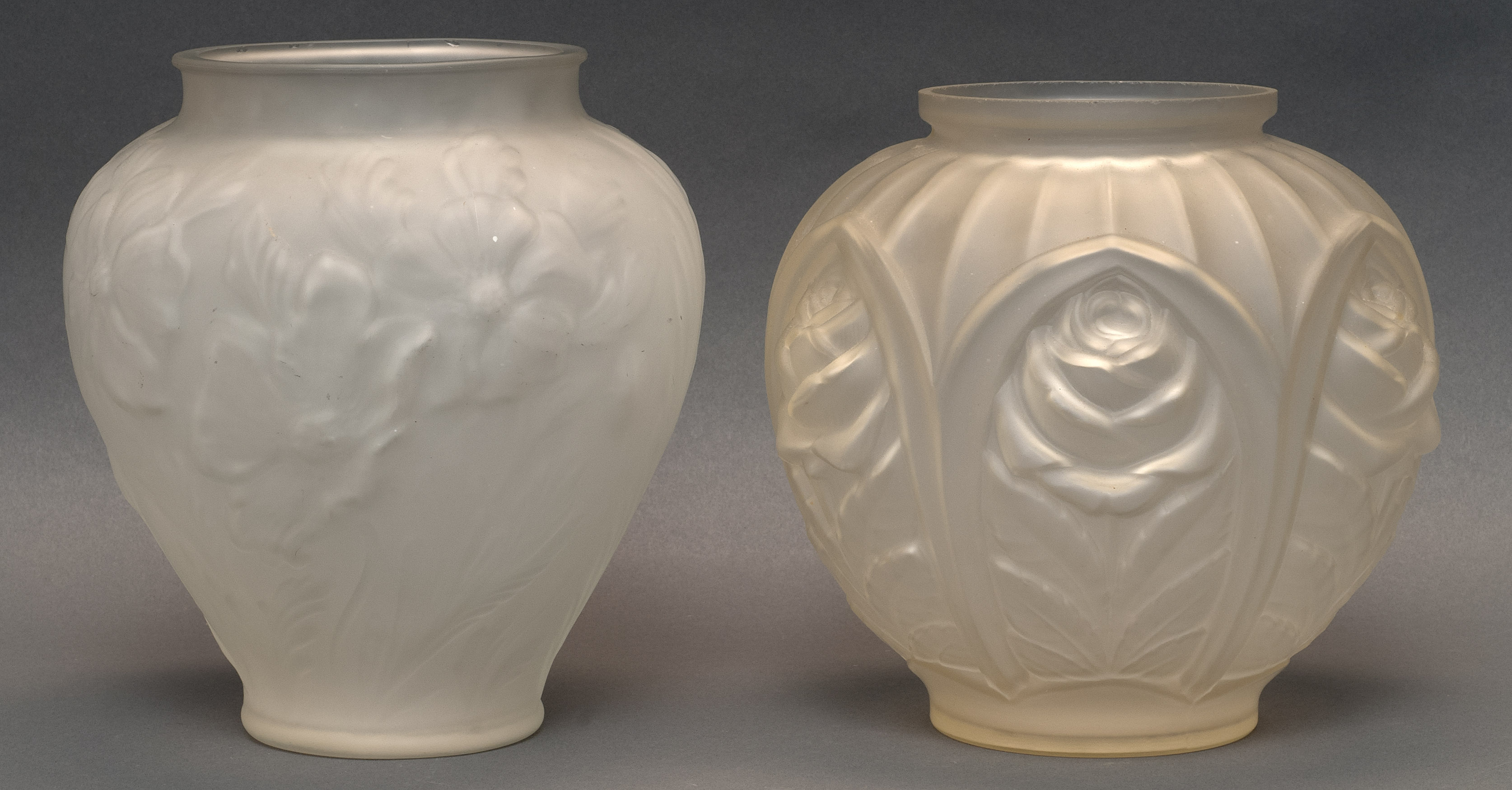 Appraisal: TWO FRENCH ART DECO MOLDED GLASS VASES sEach frosted colorless