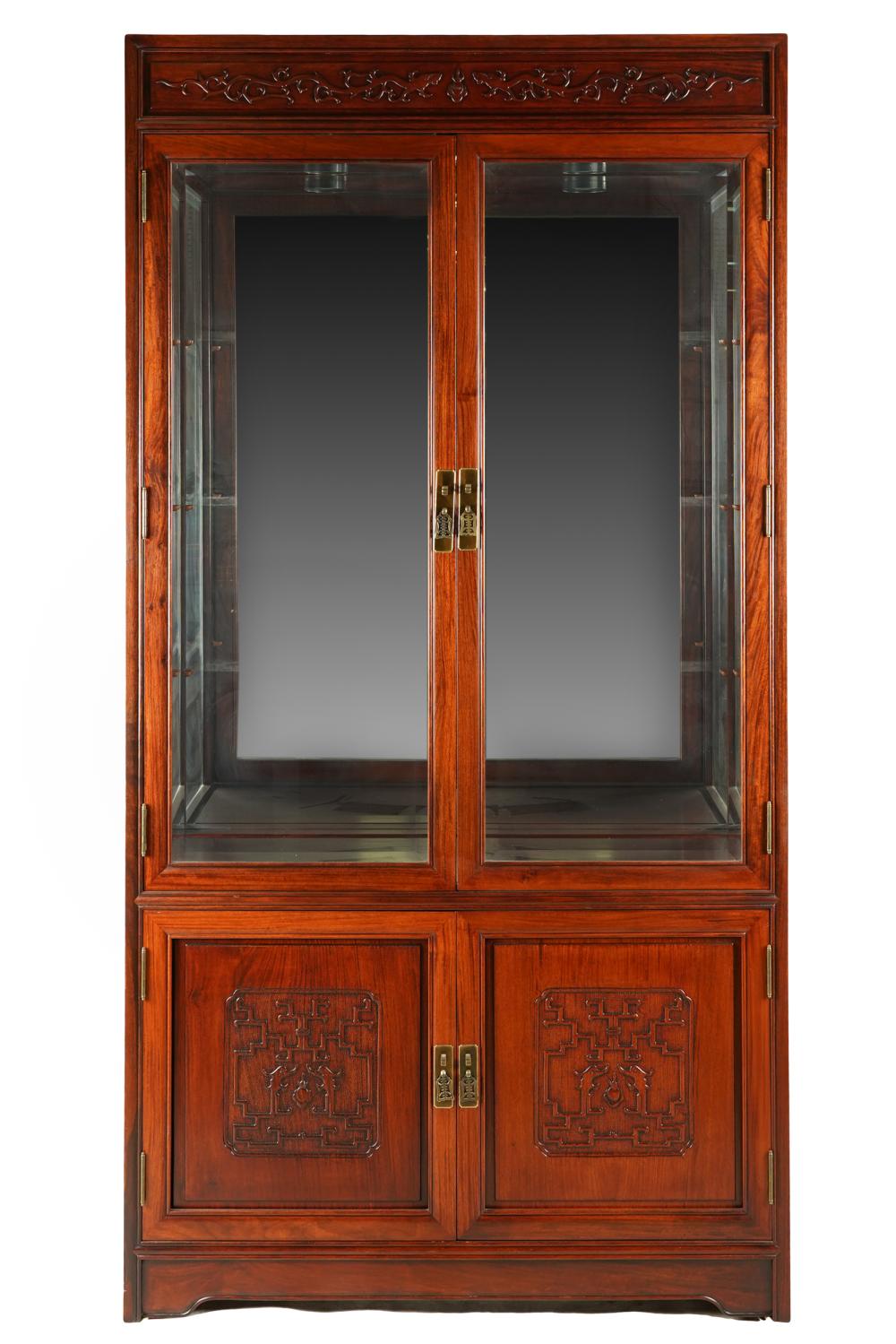 Appraisal: ASIAN STYLE CARVED WOOD GLAZED CABINETelectrified with three shelves inches