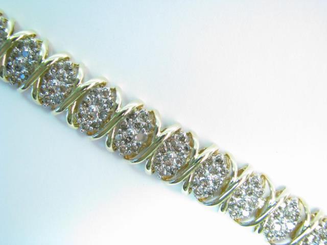 Appraisal: K yellow gold and diamond X link bracelet approximately ct