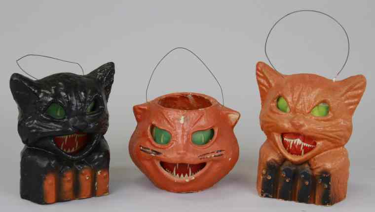 Appraisal: THREE PULP HALLOWEEN JACK-O-LANTERNS Includes black cat on fence orange