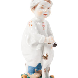 Appraisal: A Meissen Porcelain Figure of a Boy on a Pull