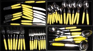 Appraisal: French stainless steel and yellow handle flatware for eight plus