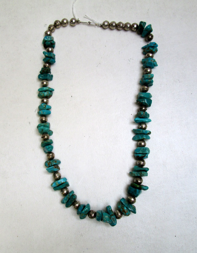 Appraisal: TURQUOISE AND SILVER SQUASH BLOSSOM NECKLACE having alternating natural cut