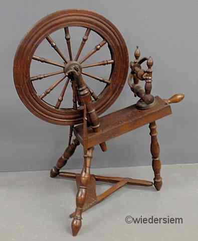 Appraisal: Oak and maple spinning wheel th c ''h x ''l