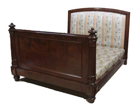 Appraisal: A th century large mahogany double bed the moulded arched