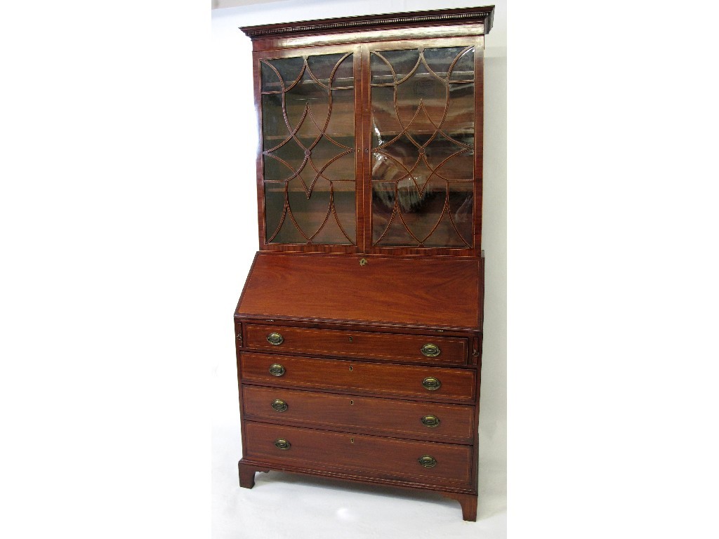 Appraisal: A George III mahogany and boxwood lined bureau the dentil