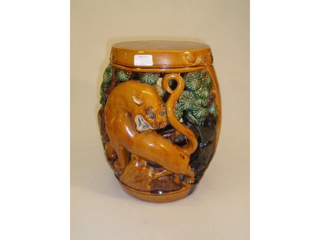 Appraisal: A Chinese pottery garden seat pierced and moulded with mythical