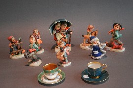 Appraisal: Eight Goebel figures together with Royal Worcester coffee cups and