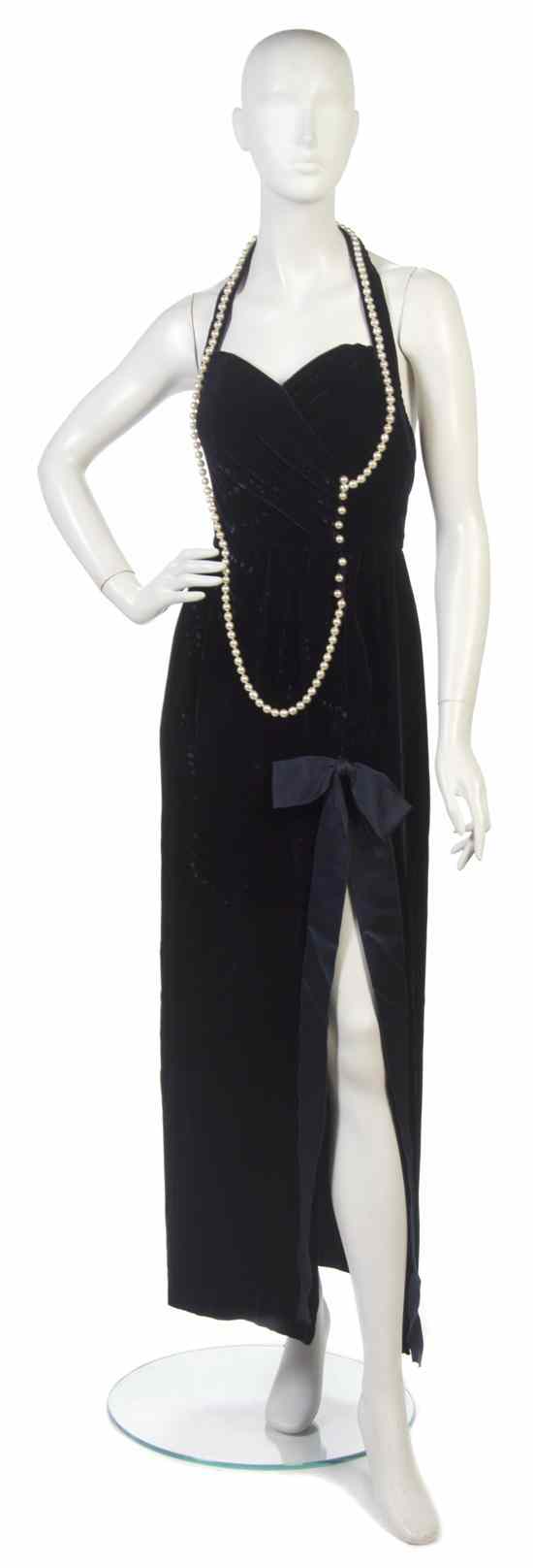 Appraisal: A Chanel Purple Velvet Evening Gown with pearl sautoir detail