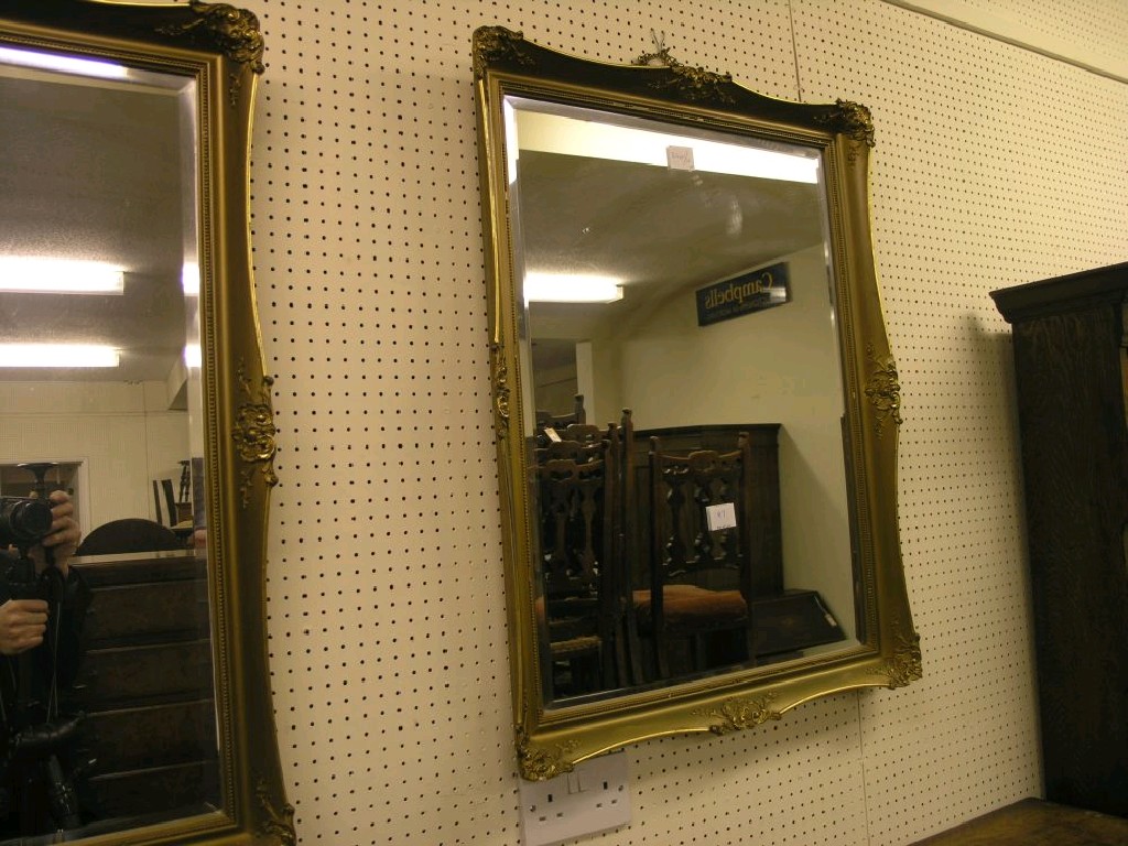 Appraisal: A pair of gilt-framed mirrors rectangular shape with moulded detail