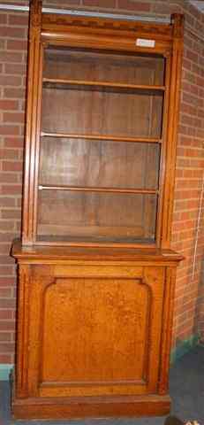 Appraisal: A VICTORIAN PALE OAK BOOKCASE with Gothic decoration the upper