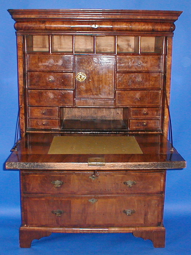 Appraisal: A Queen Anne walnut secretaire with moulded cornice and shallow