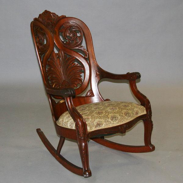 Appraisal: American Rococo Revival pierce carved and laminated rosewood barrel back