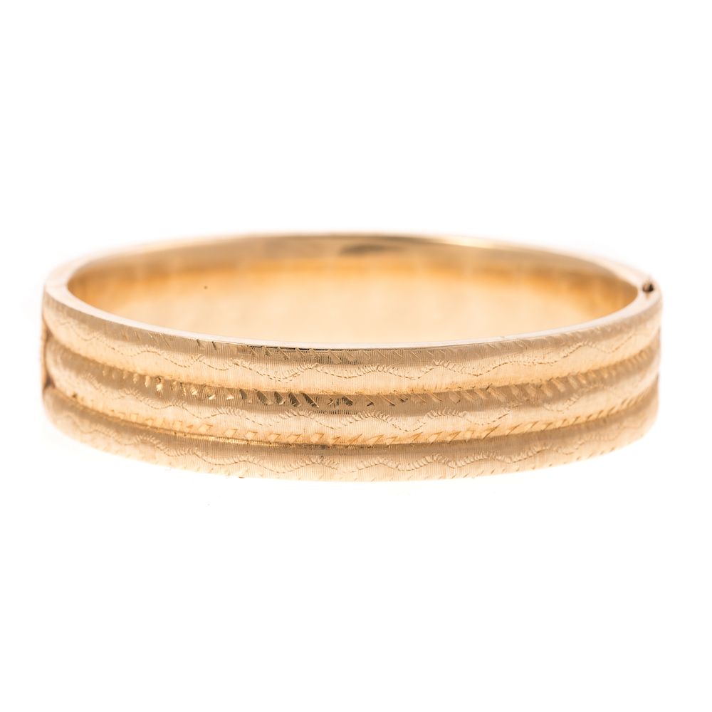 Appraisal: A Ladies Engraved Wide Bangle Bracelet in K K yellow