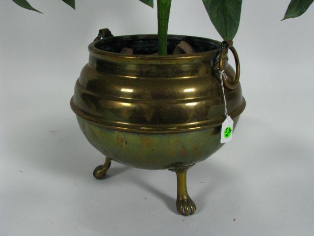 Appraisal: Cast metal brass finish planter with brass paw feet