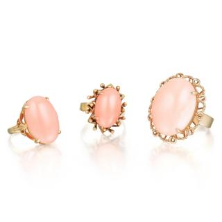 Appraisal: A Lot of Three Coral Rings Comprising three oval-shaped cabochon