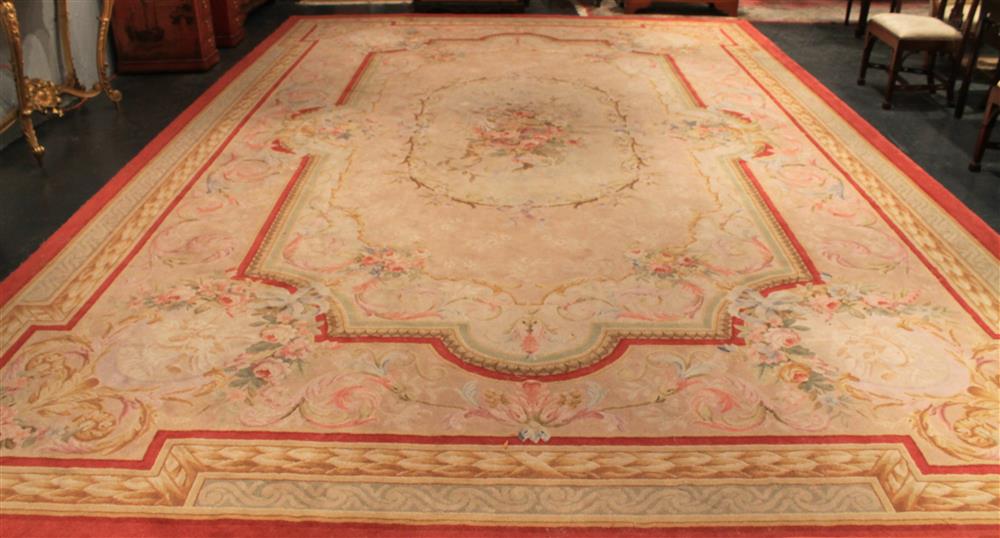 Appraisal: LARGE STARK SAVONNERIE CARPET with rose colored border having cream