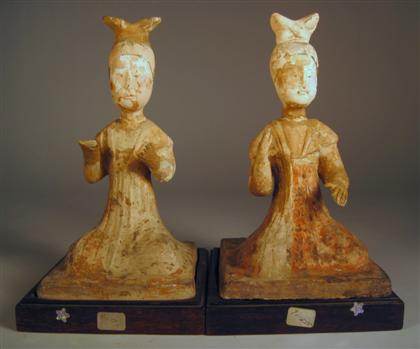 Appraisal: Pair of Chinese pottery attendant figurestang dynasty