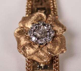 Appraisal: LADIES K YELLOW GOLD AND DIAMOND WATCH LADIES K YELLOW