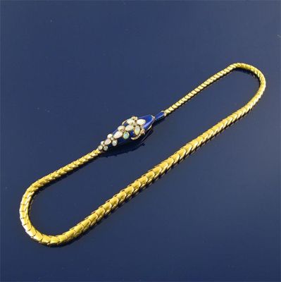 Appraisal: A Victorian gold serpent necklace the head set with opals