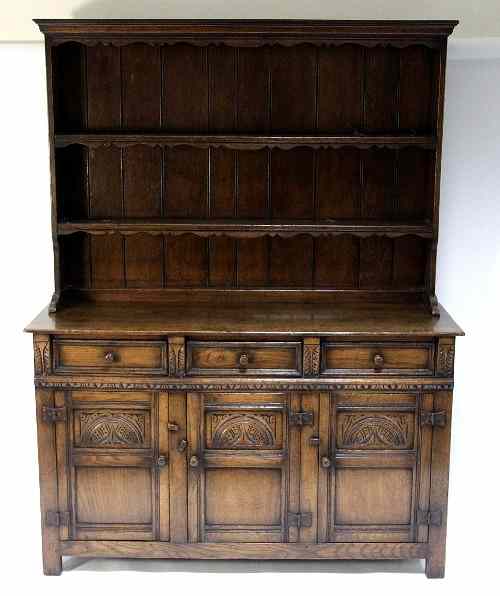 Appraisal: A Jacobean revival oak dresser with rack with shaped cornice