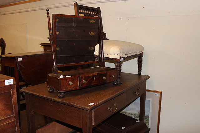 Appraisal: A GEORGIAN OAK SIDE TABLE with two frieze drawers and