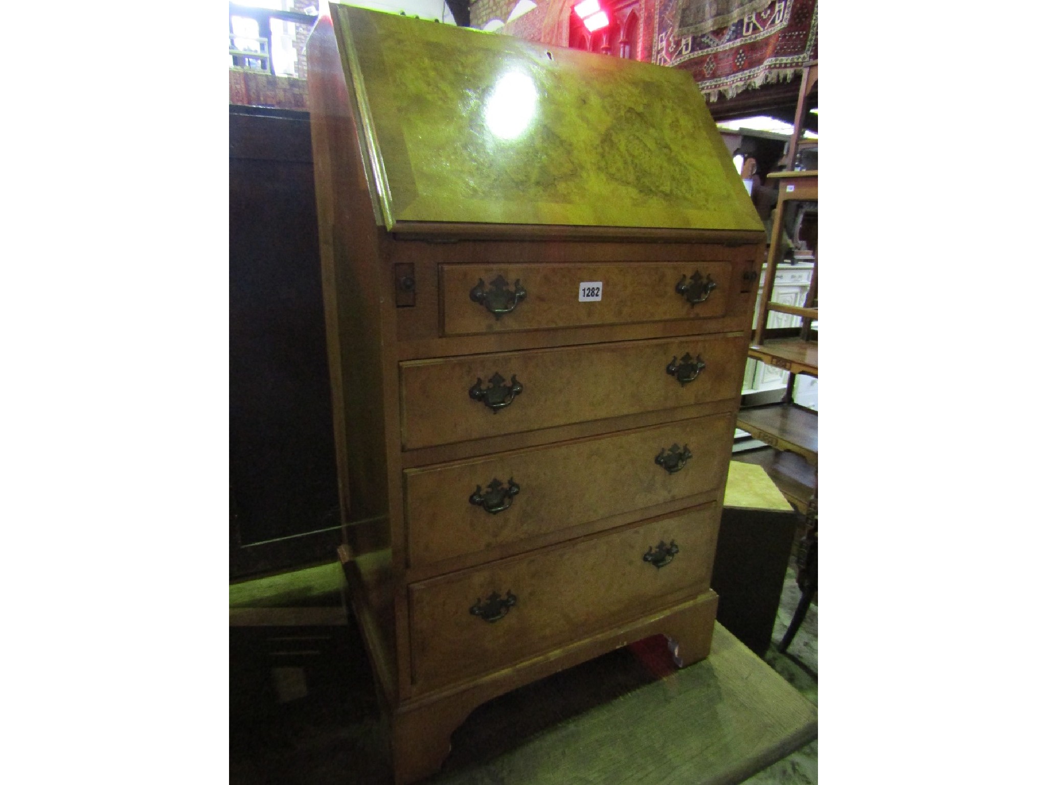 Appraisal: A reproduction Georgian style walnut veneered ladies writing bureau with