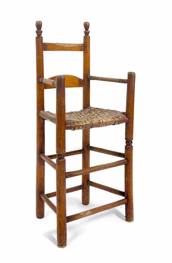 Appraisal: An American Maple Child's High Chair having a woven wood