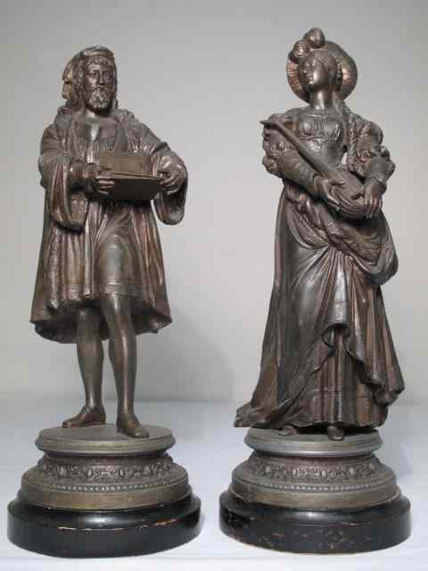 Appraisal: Two th century cast white metal sculptures of a man