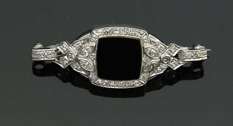 Appraisal: PLATINUM AND DIAMOND BROOCH Converted watch is made into an