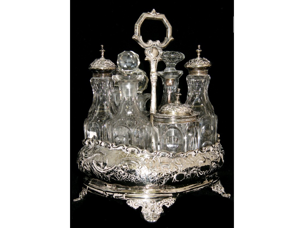 Appraisal: Early Victorian seven bottle cruet the circular stand with a