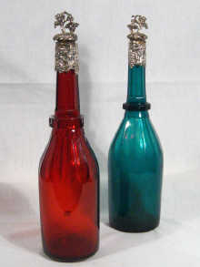 Appraisal: A pair of silver mounted glass decanter bottles one Bristol