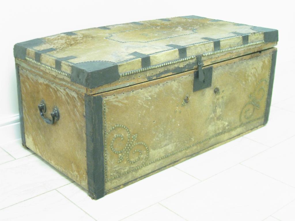 Appraisal: A hide covered Trunk metal bound with stud work and