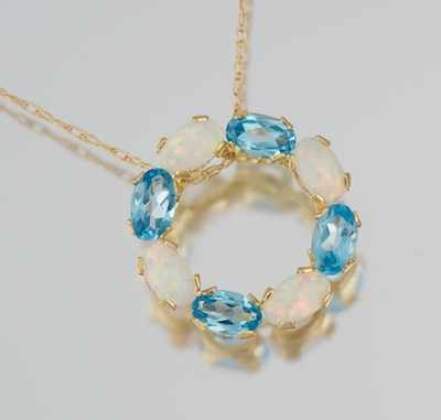 Appraisal: A Delicate Topaz and Opal Circle Pendant on Chain k