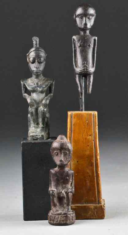 Appraisal: African Bronze SculpturesEach depicting figures in various poses two raised