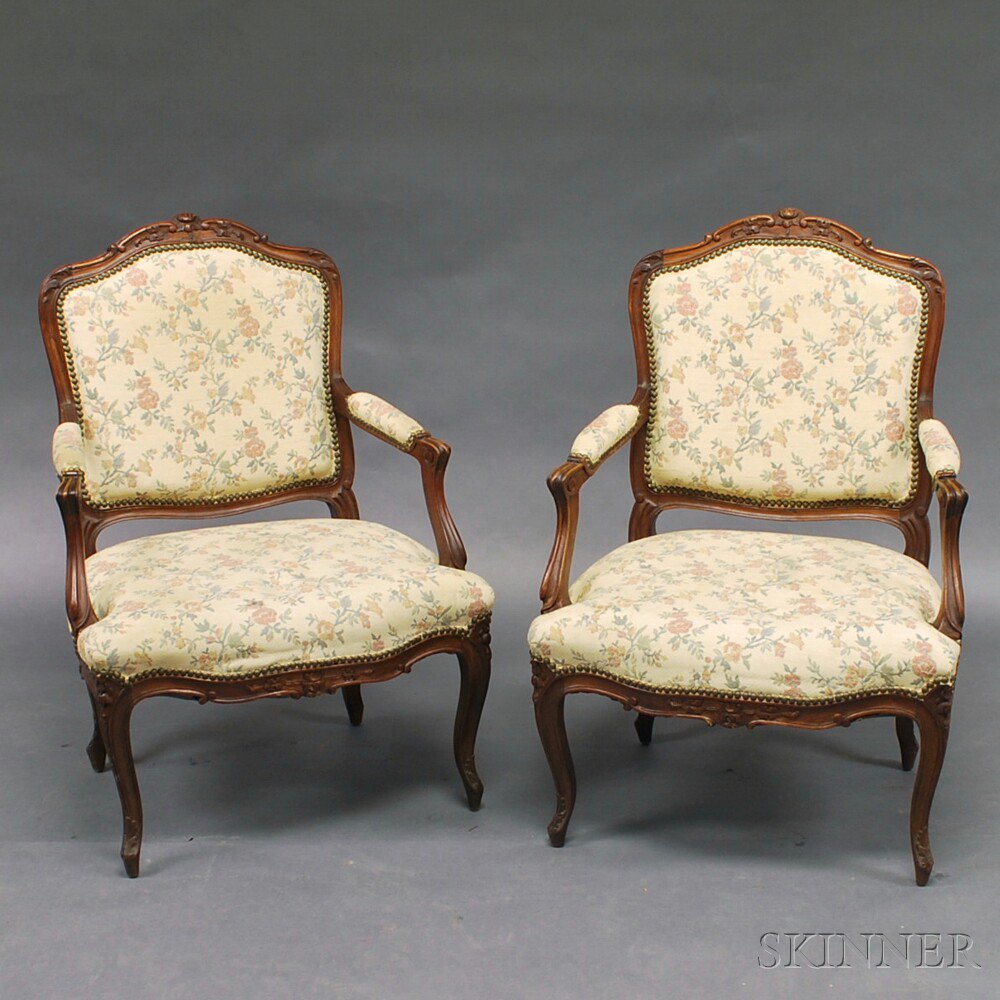 Appraisal: Pair of French Provincial Walnut Fauteuil th century with floral-carved