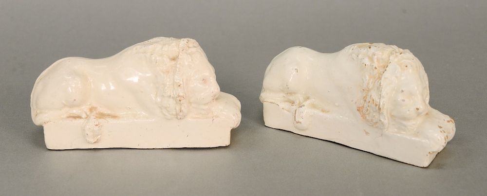 Appraisal: Pair of Staffordshire recumbent lion statues white glazed ht in